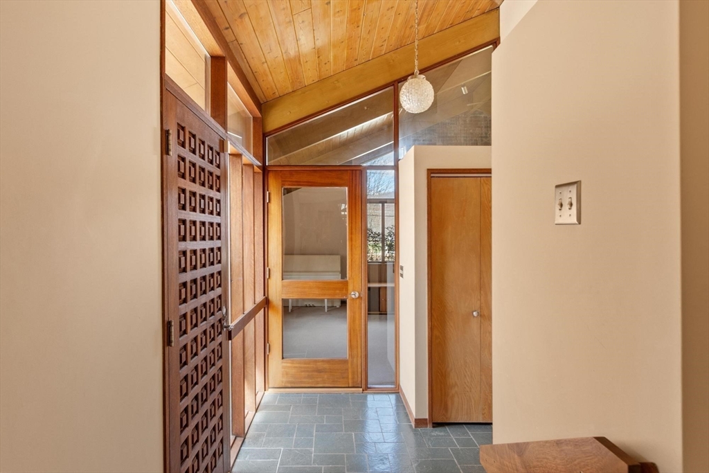 243 Concord Road Westford, MA 01886 - Photo 6 of 42 a view of a hallway with wooden shelves