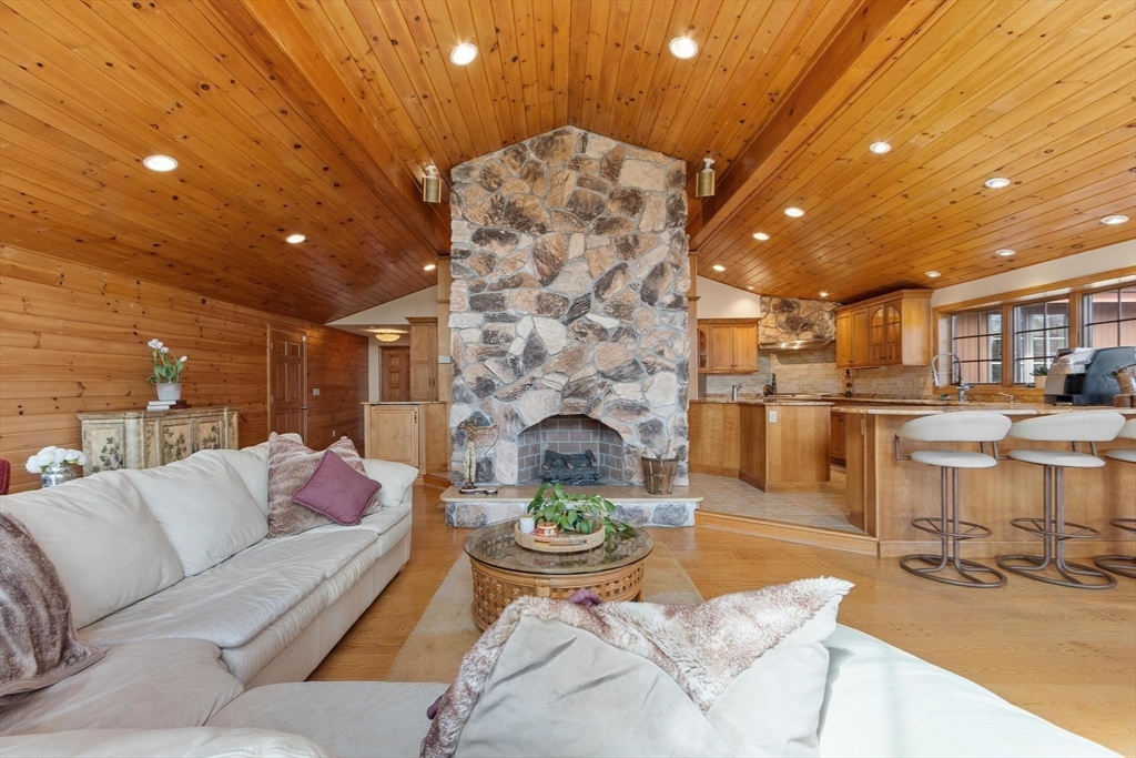 243 Concord Road Westford, MA 01886 - Photo 9 of 42 a living room with furniture and a fireplace