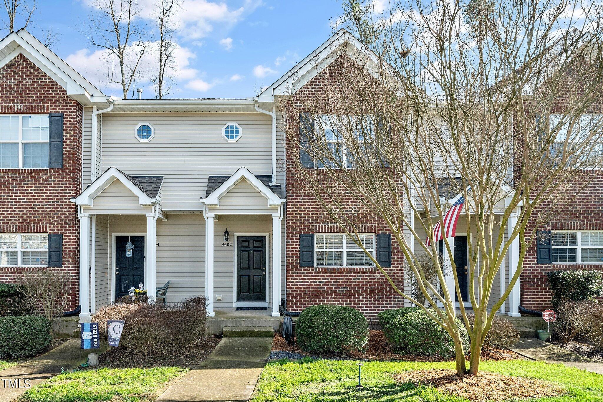 4602 Centrebrook Circle Raleigh, NC 27616 - Photo 1 of 24 a front view of a house with garden