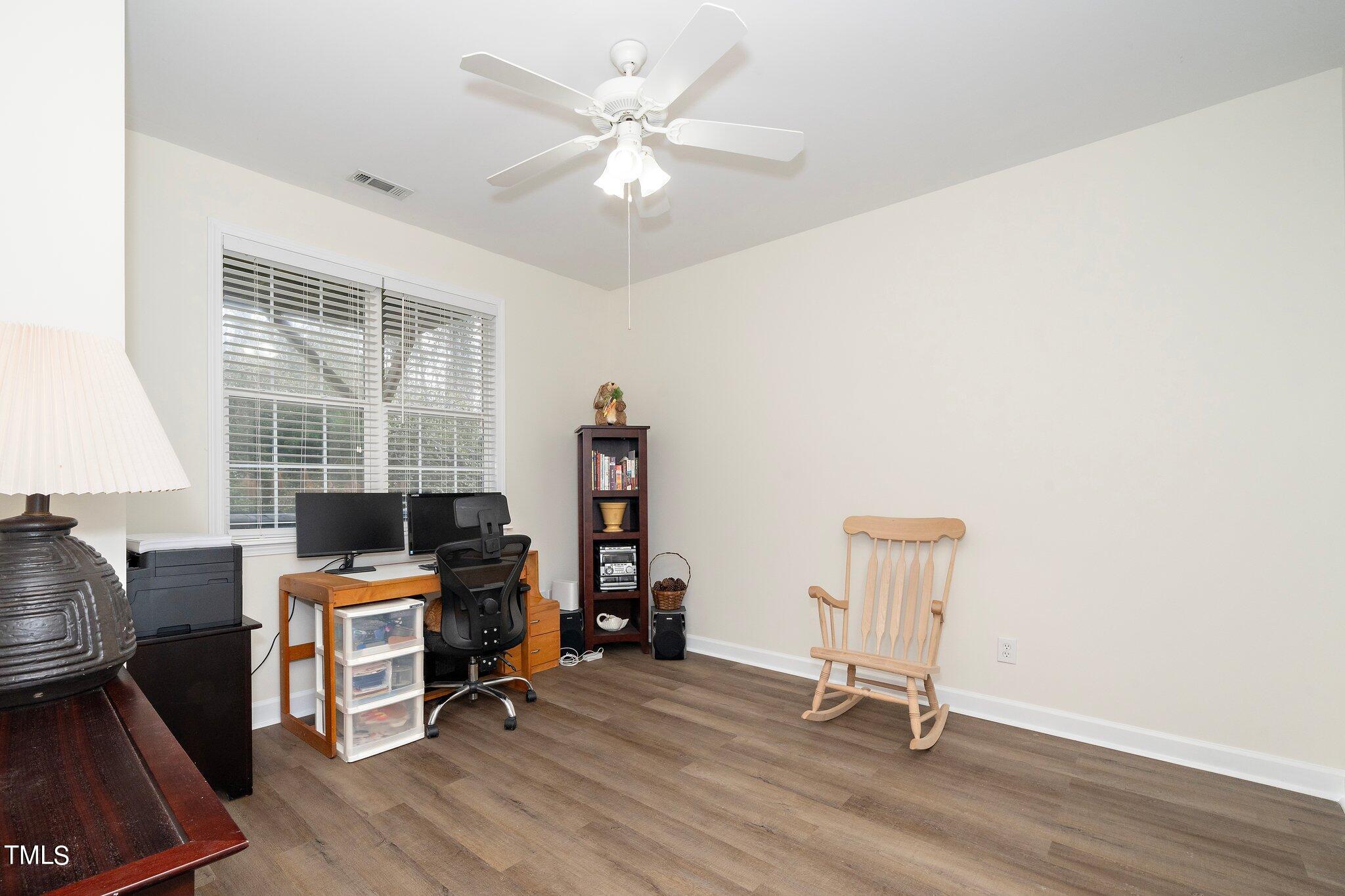 4602 Centrebrook Circle Raleigh, NC 27616 - Photo 11 of 24 a view of a workspace with furniture and a window