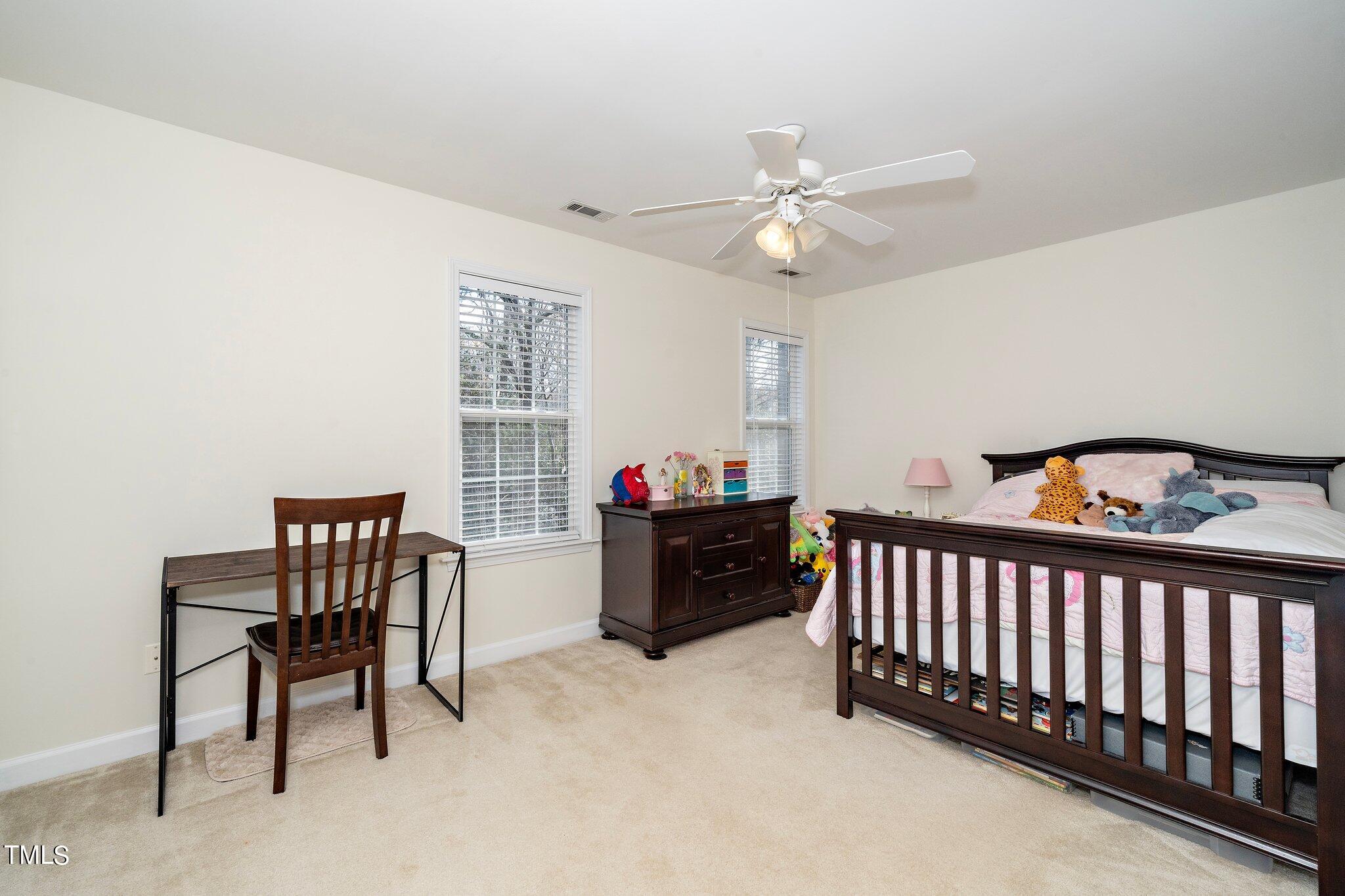 4602 Centrebrook Circle Raleigh, NC 27616 - Photo 13 of 24 a bed room with furniture and a window