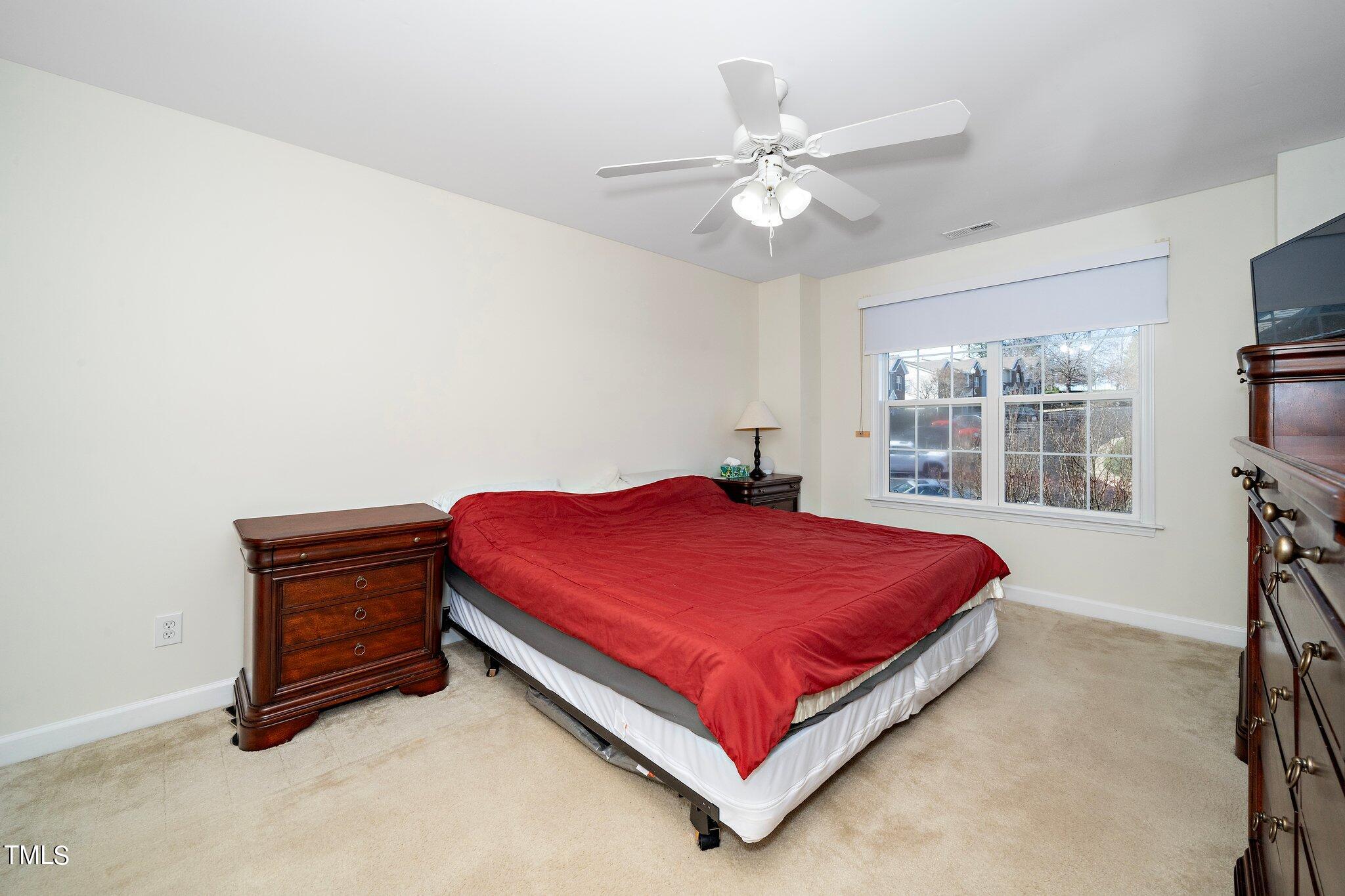 4602 Centrebrook Circle Raleigh, NC 27616 - Photo 14 of 24 a bedroom with a bed and window