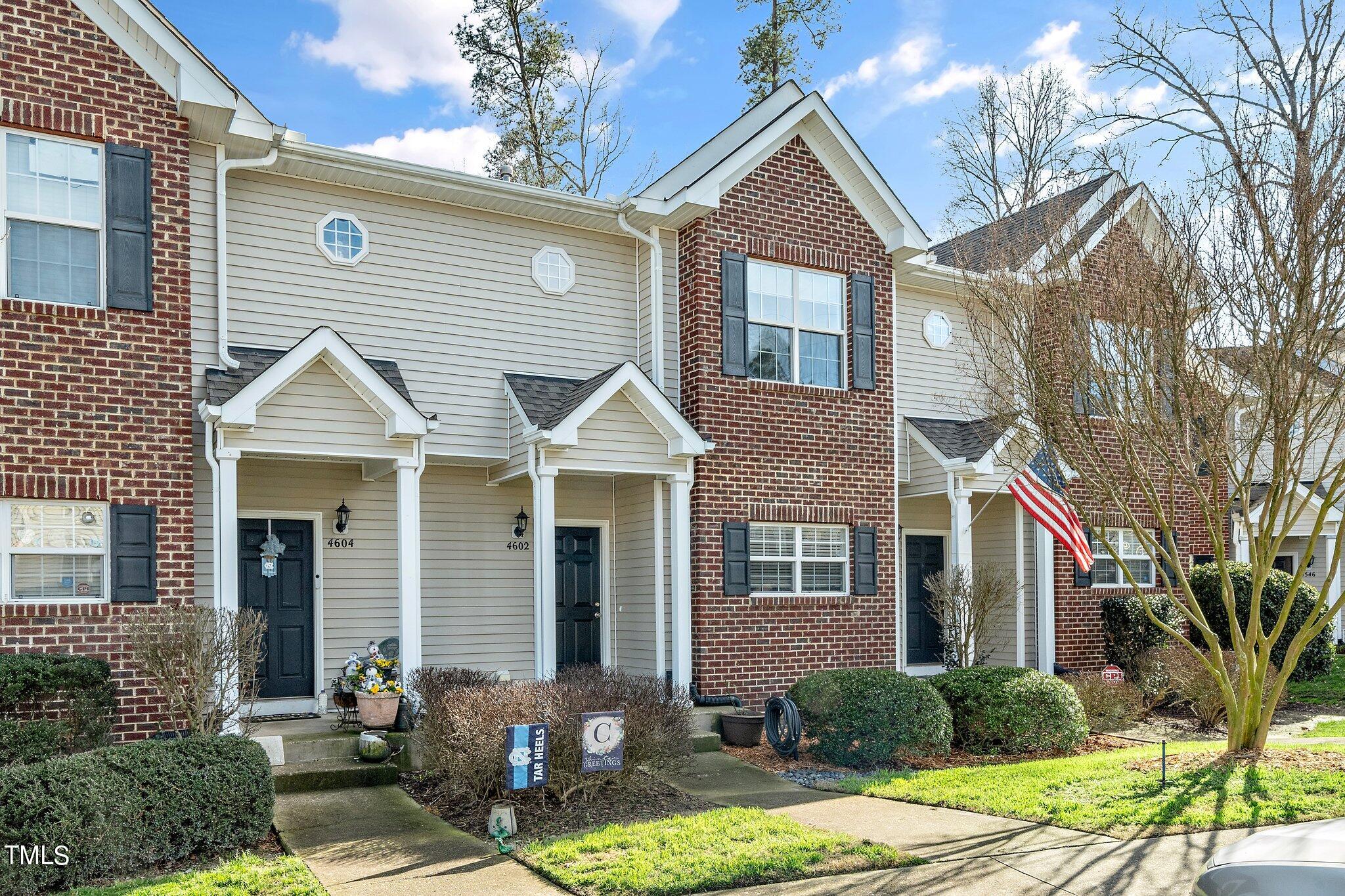 4602 Centrebrook Circle Raleigh, NC 27616 - Photo 2 of 24 a front view of a house with garden
