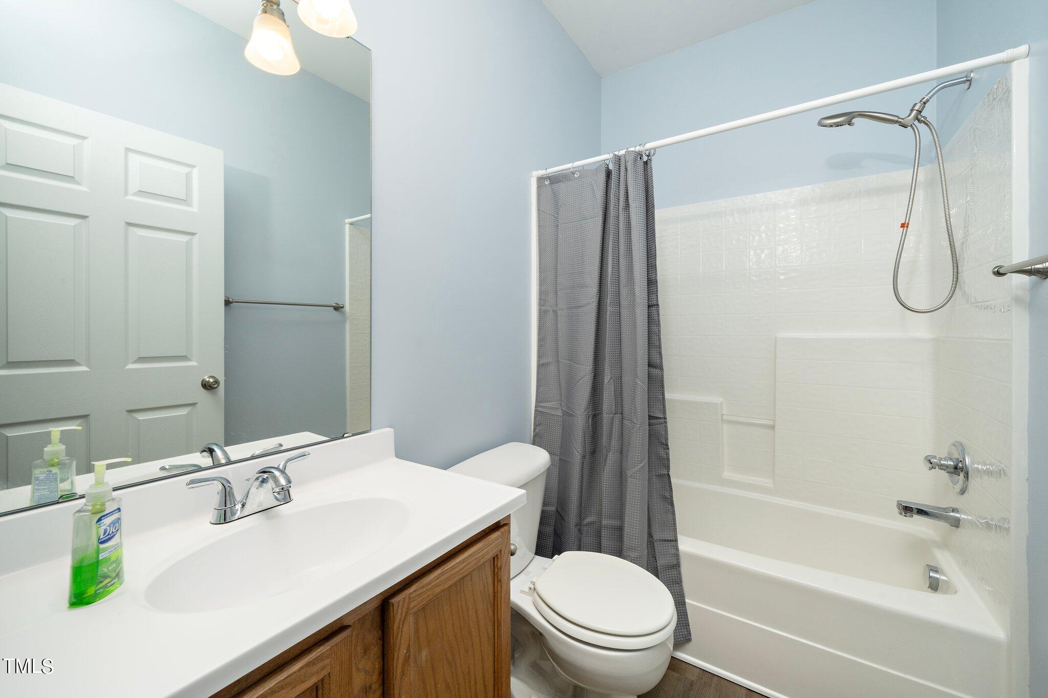 4602 Centrebrook Circle Raleigh, NC 27616 - Photo 10 of 24 a bathroom with a sink toilet and shower