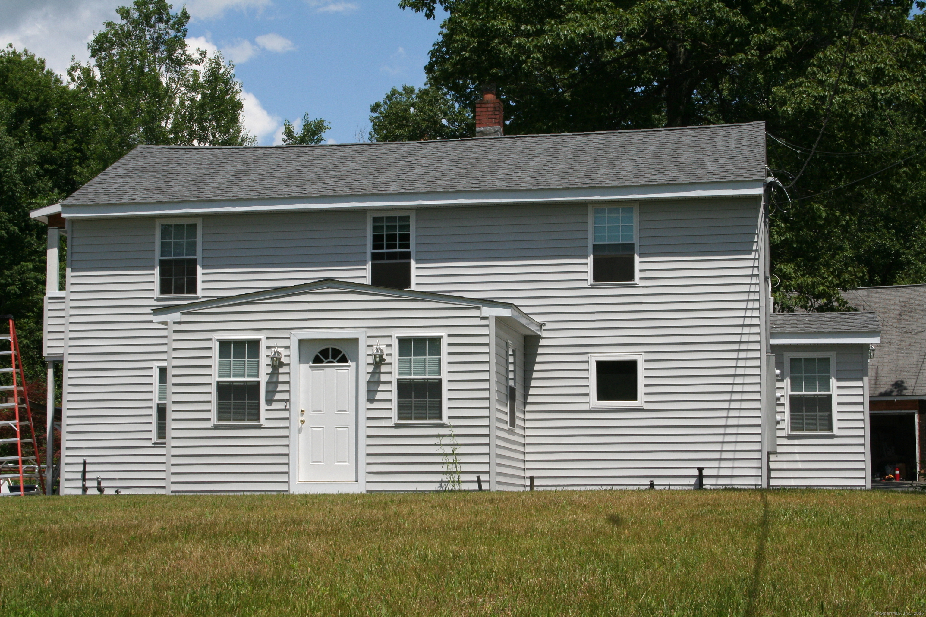 80 Canal Road Granby, CT 06035 - Photo 1 of 1 a front view of a house with a yard