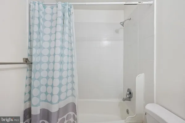 a bathroom with a bathtub and shower