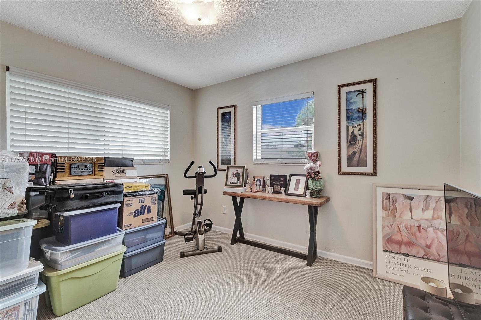 534 West 53rd Terrace Hialeah, FL 33012 - Photo 20 of 34 a view of a workspace with furniture and a window