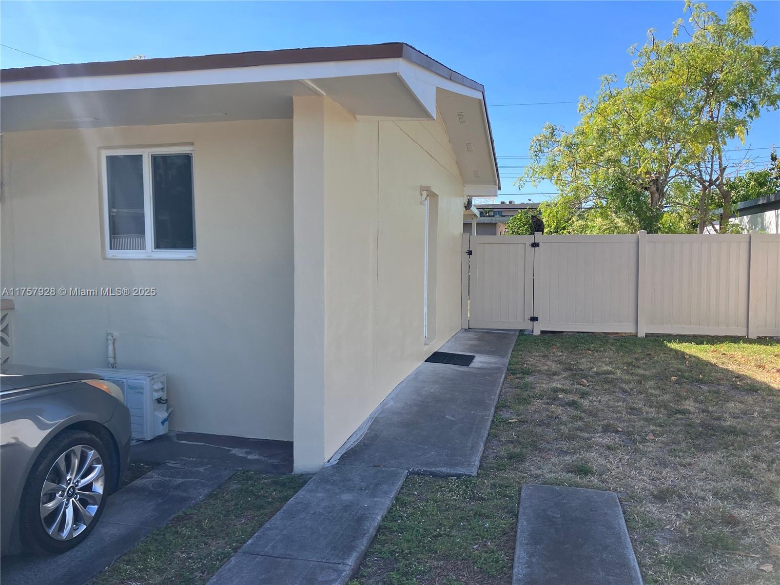 534 West 53rd Terrace Hialeah, FL 33012 - Photo 28 of 34 a view of a house with a backyard and parking space