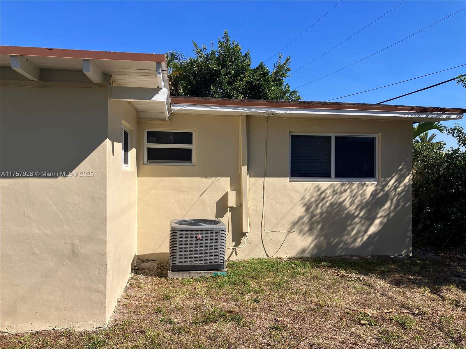 534 West 53rd Terrace Hialeah, FL 33012 - Photo 31 of 34 a view of a house with a door and a yard
