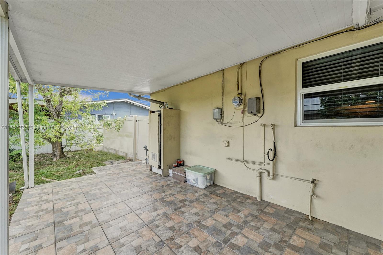 534 West 53rd Terrace Hialeah, FL 33012 - Photo 6 of 34 a spacious bathroom with a granite countertop sink and a mirror
