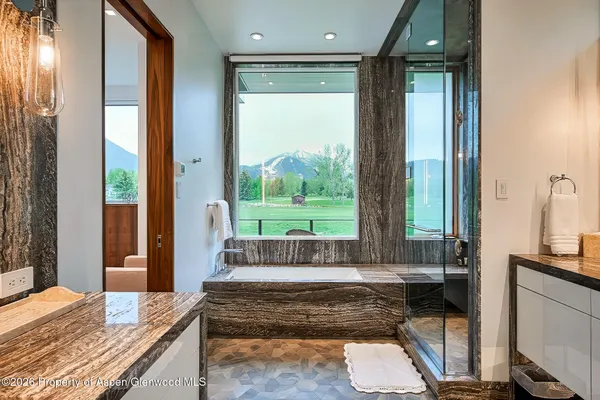 a bathroom with a tub toilet and sink