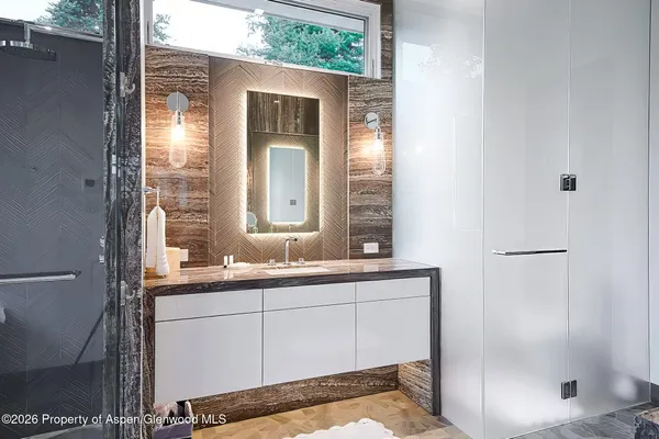 a bathroom with a sink and a mirror