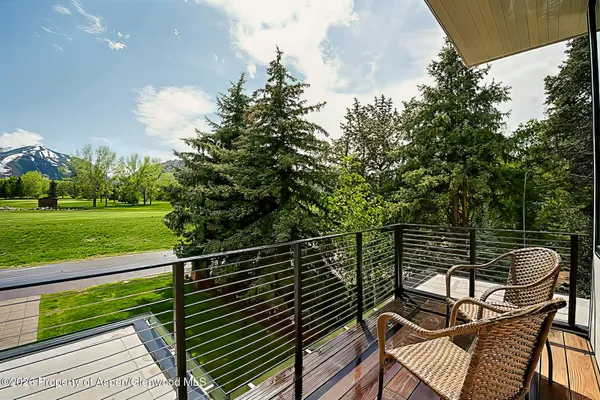 swimming pool view with a seating space