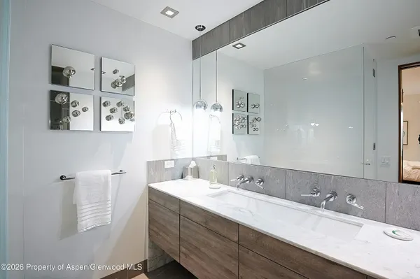 a bathroom with a double vanity sink mirror and double