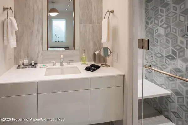 a bathroom with a sink and a mirror