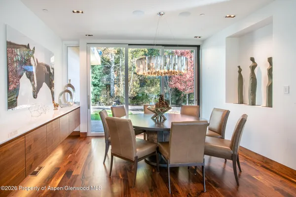 a dining room with furniture window wooden floor
