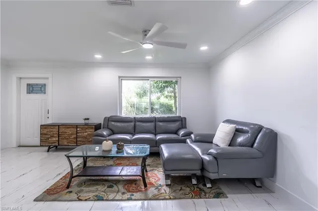 a living room with furniture and a window
