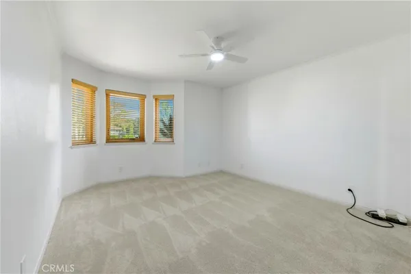 a view of a room with furniture and a fireplace
