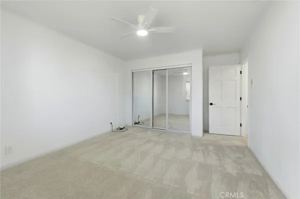 a view of an empty room with a fireplace