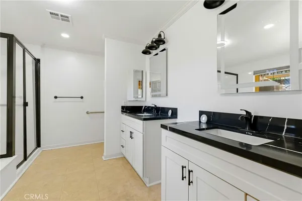 a bathroom with a bathtub and shower