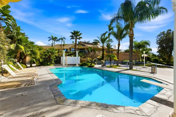 a view of a swimming pool with a patio