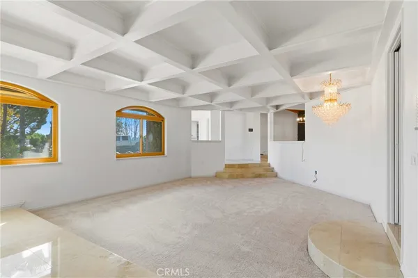 a view of empty room with windows