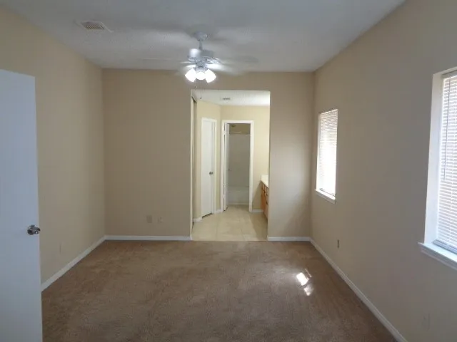 a bathroom with a toilet and a bathtub