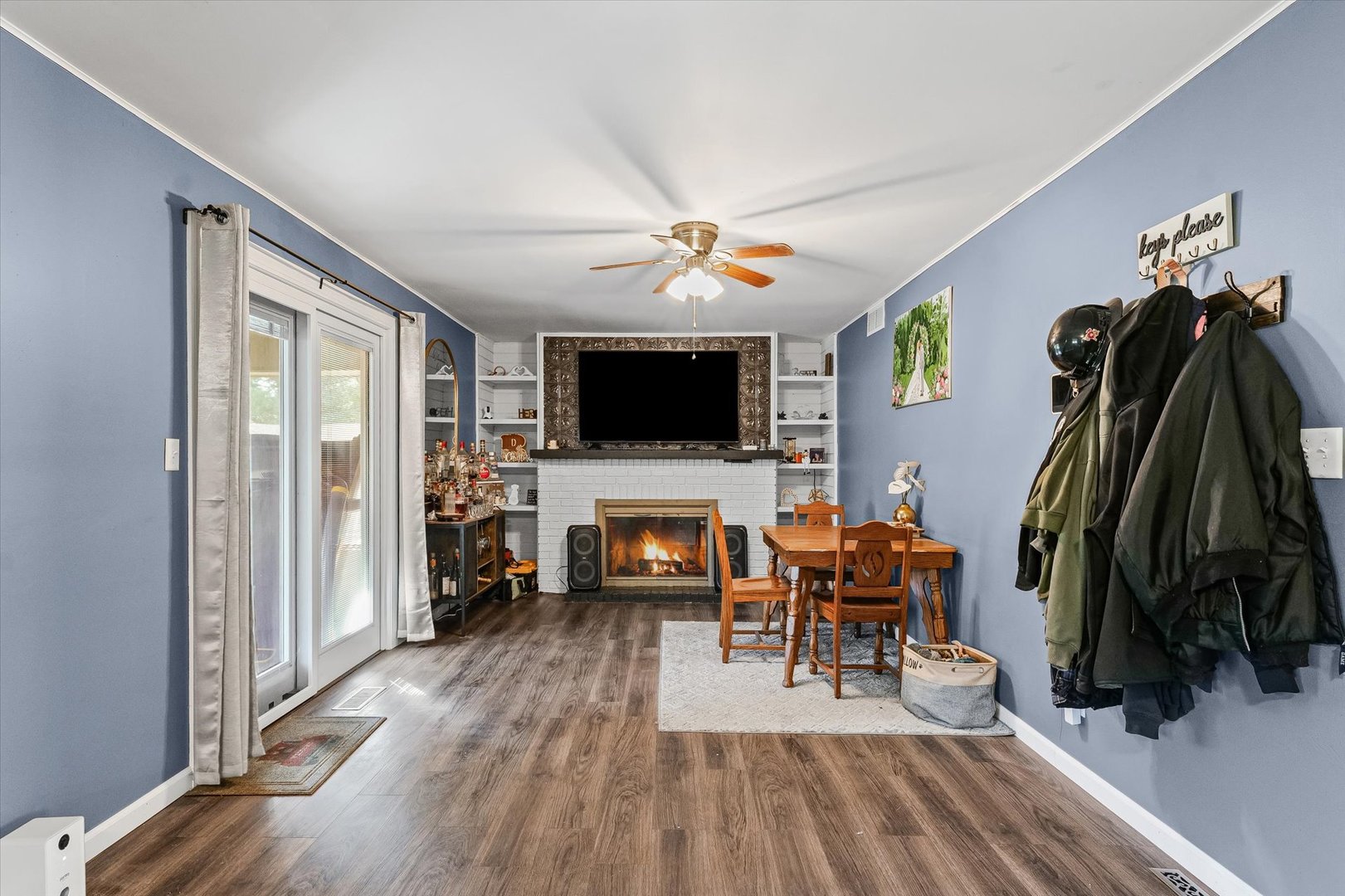 1715 Phillippe Drive Mahomet, IL 61853 - Photo 11 of 30 a living room with furniture and a flat screen tv