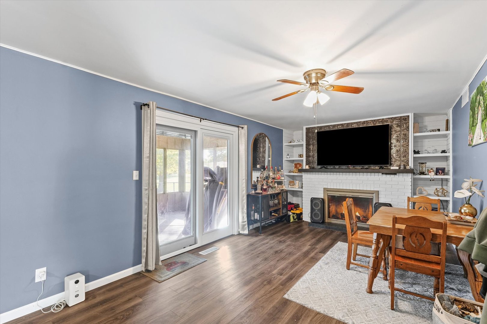 1715 Phillippe Drive Mahomet, IL 61853 - Photo 12 of 30 a living room with furniture and a flat screen tv