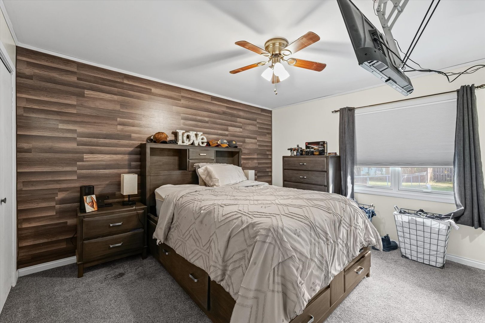 1715 Phillippe Drive Mahomet, IL 61853 - Photo 17 of 30 a bedroom with a bed and a chandelier