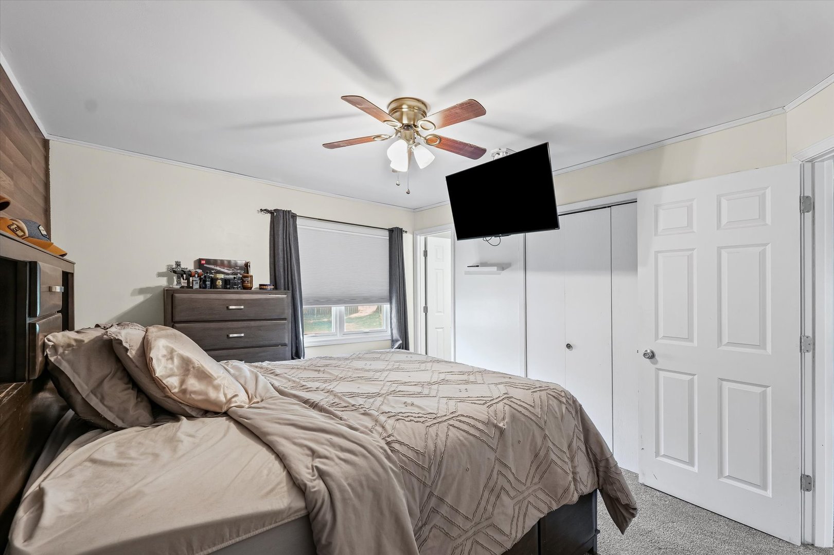 1715 Phillippe Drive Mahomet, IL 61853 - Photo 18 of 30 a bedroom with a bed and a flat screen tv