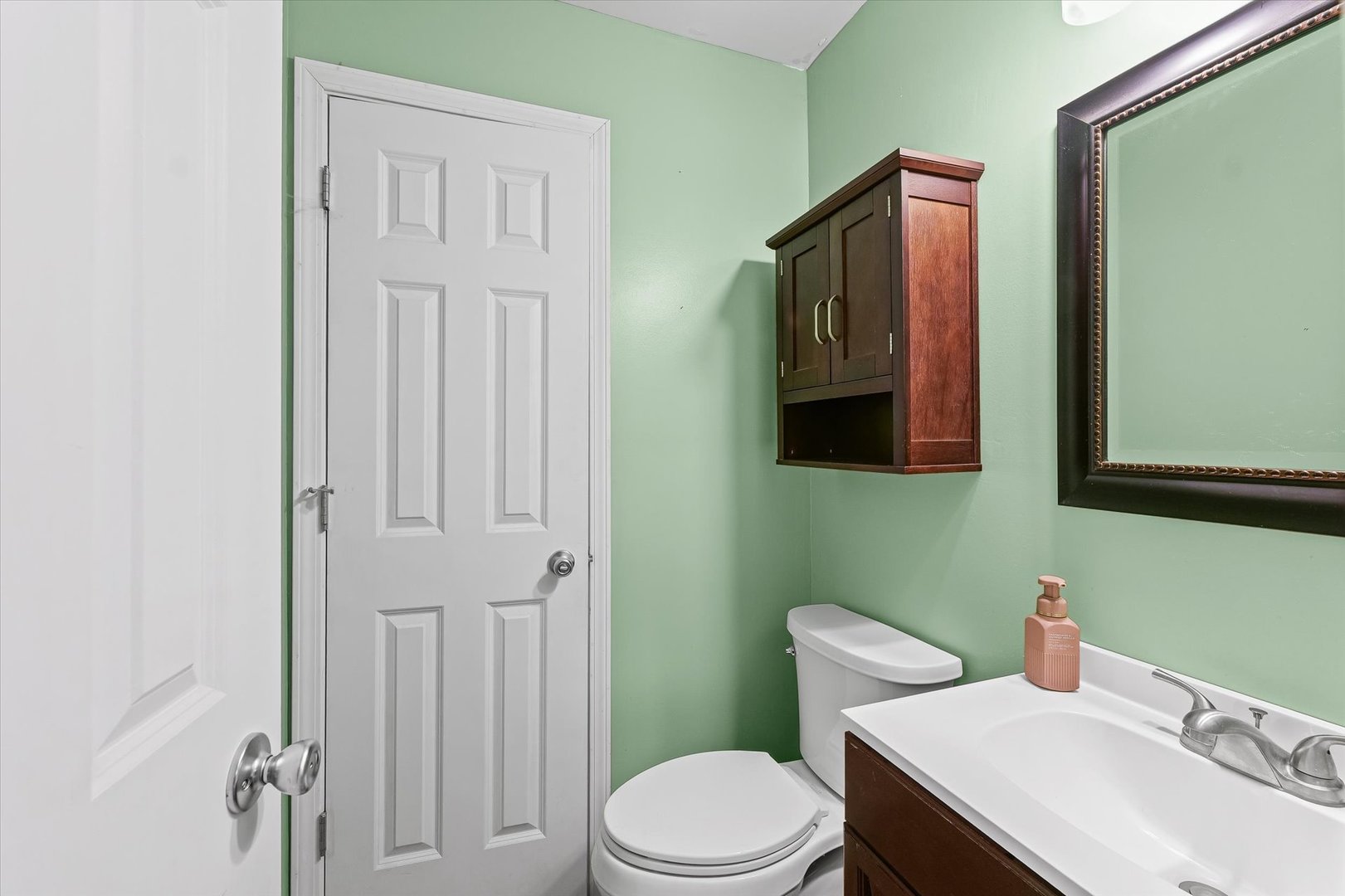 1715 Phillippe Drive Mahomet, IL 61853 - Photo 19 of 30 a bathroom with a sink a toilet and mirror