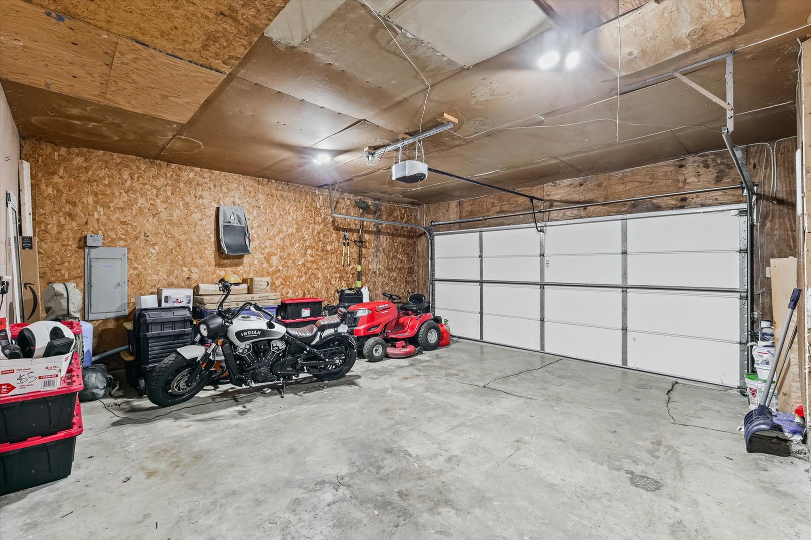 1715 Phillippe Drive Mahomet, IL 61853 - Photo 24 of 30 a view of a garage with parked cars