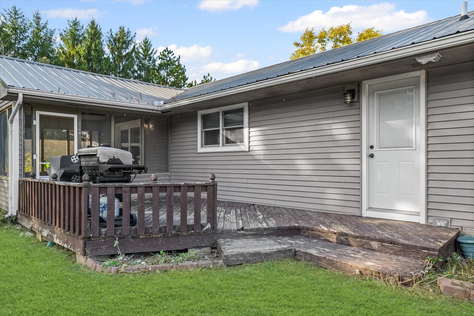 1715 Phillippe Drive Mahomet, IL 61853 - Photo 29 of 30 a view of a house with a yard and deck
