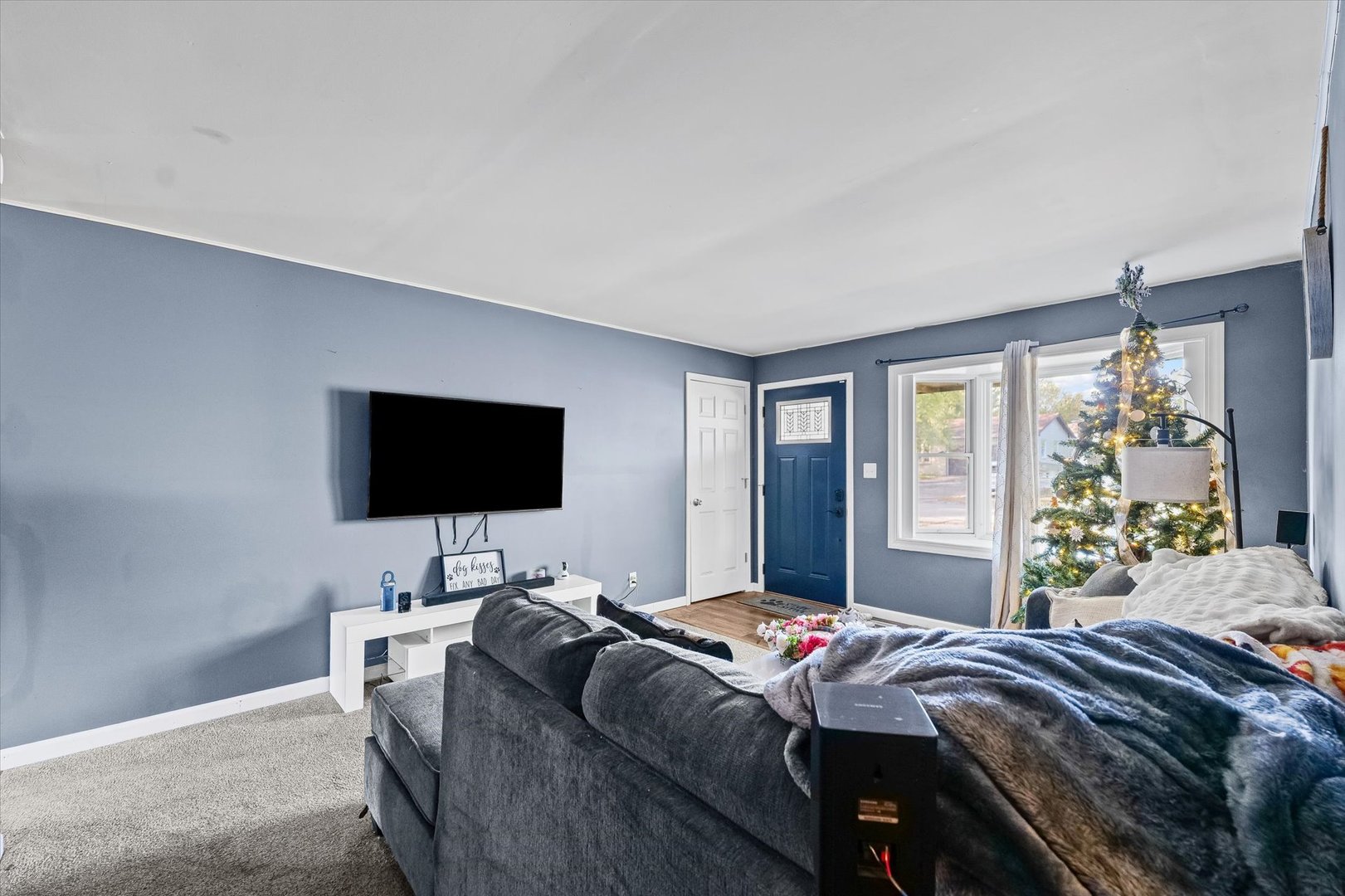 1715 Phillippe Drive Mahomet, IL 61853 - Photo 6 of 30 a bedroom with a bed and a flat screen tv