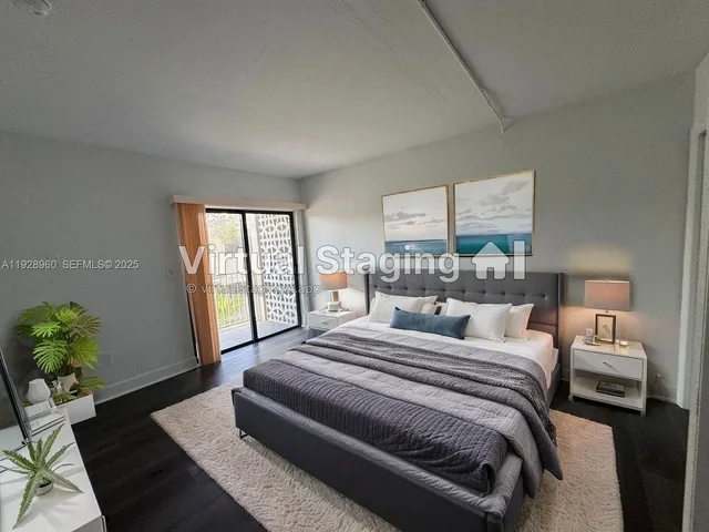 a bedroom with a large bed and a couch