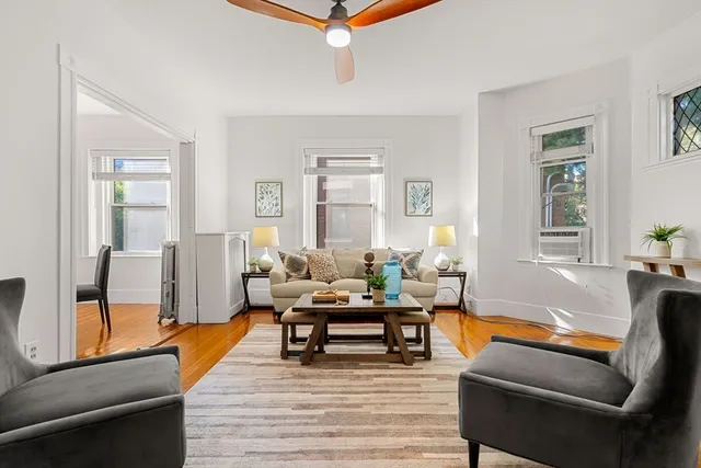a living room with furniture and a table