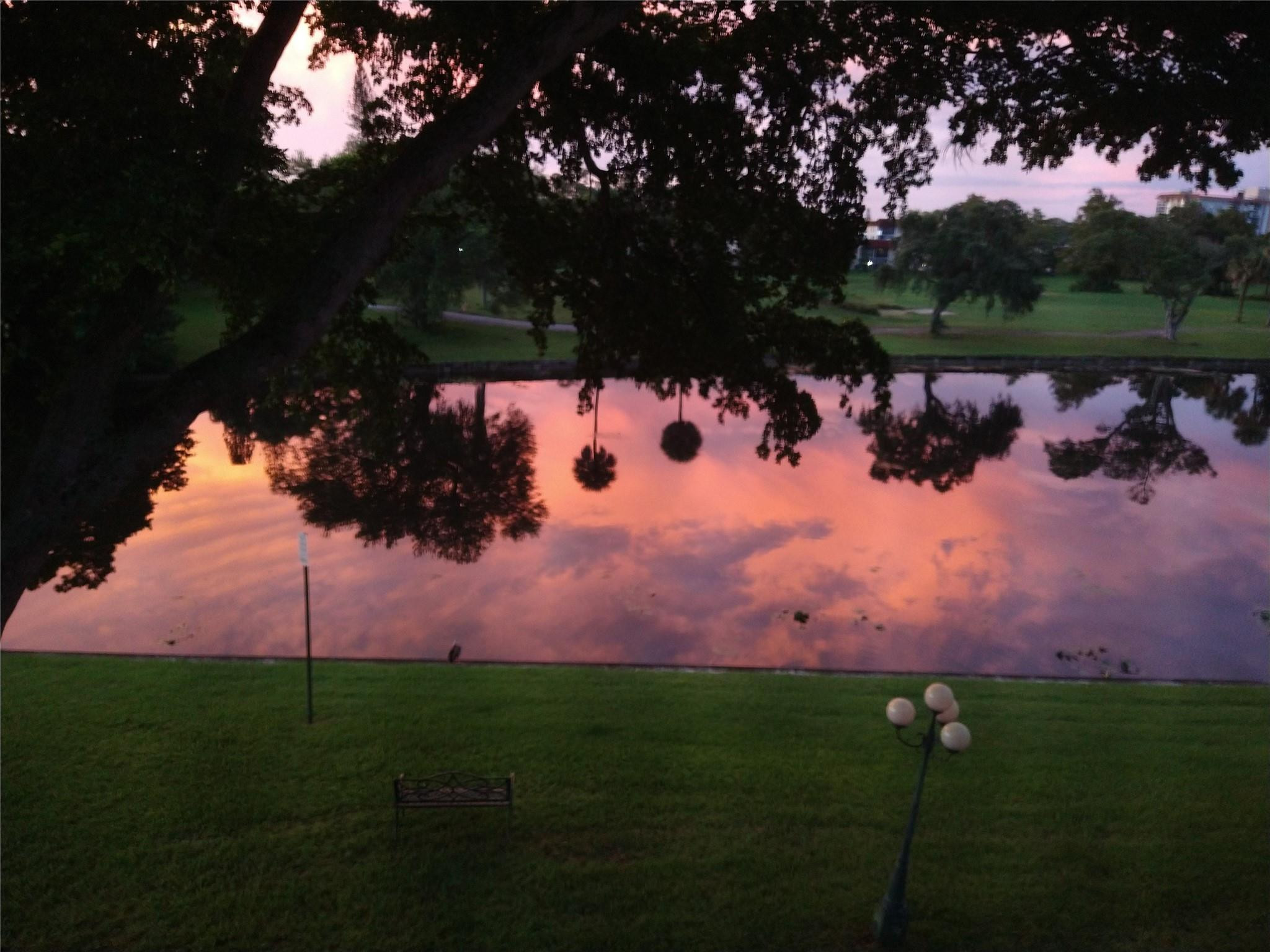 a view of a lake in front of house and outdoor space