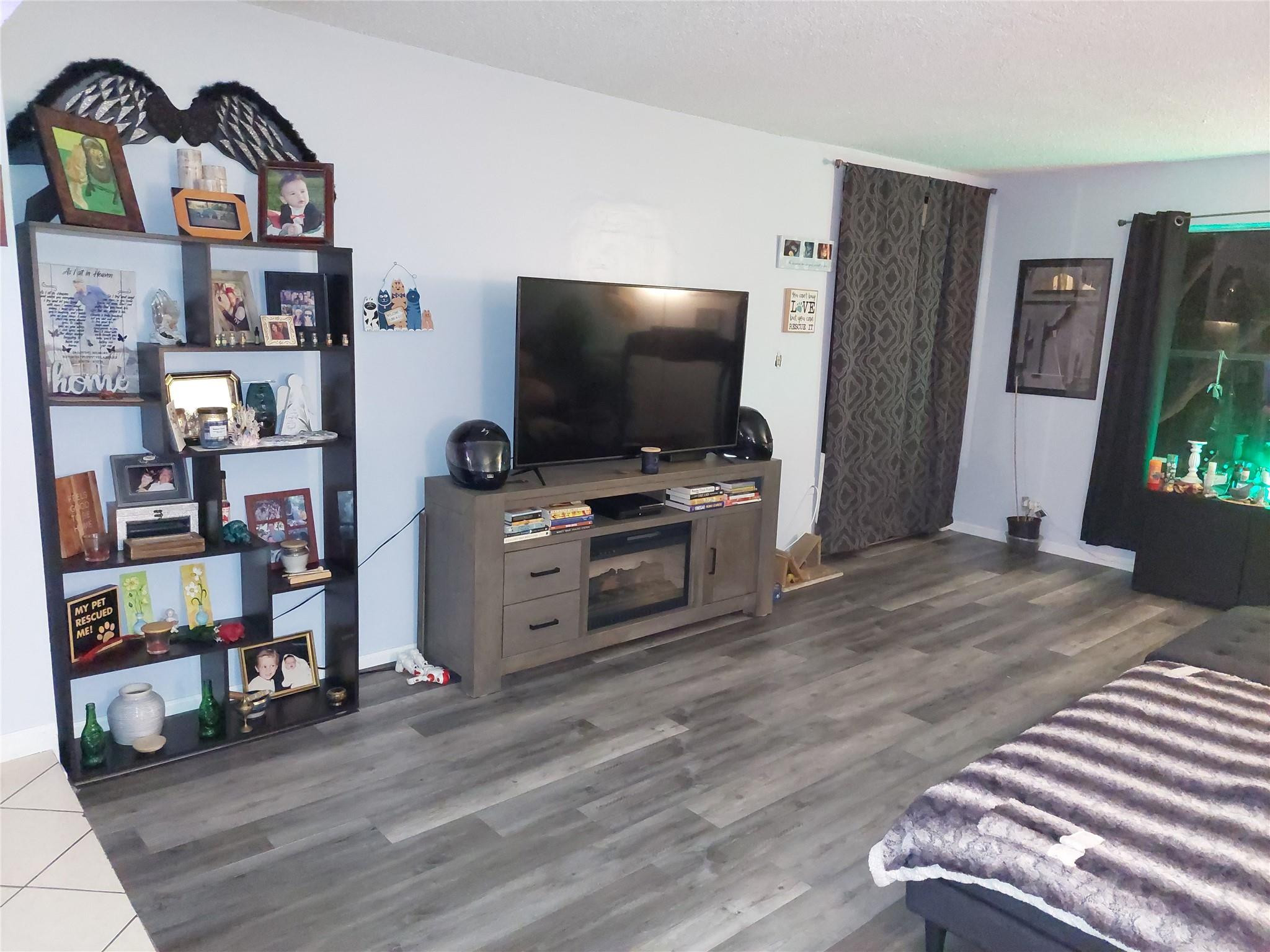 3760 Inverrary Drive, Unit 3L Lauderhill, FL 33319 - Photo 2 of 10 a living room with furniture and a flat screen tv
