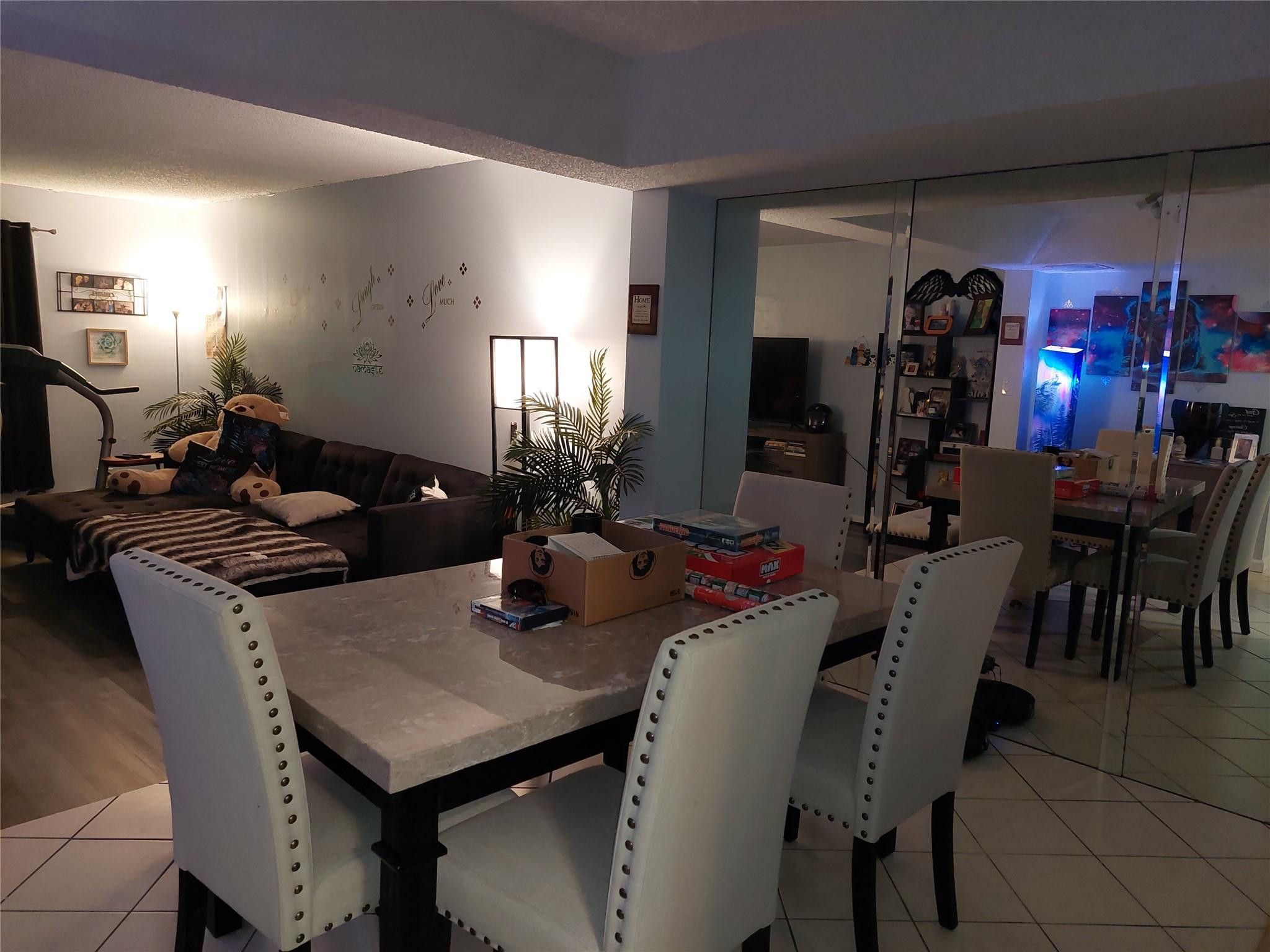 3760 Inverrary Drive, Unit 3L Lauderhill, FL 33319 - Photo 4 of 10 a view of a dining room with furniture and wooden floor
