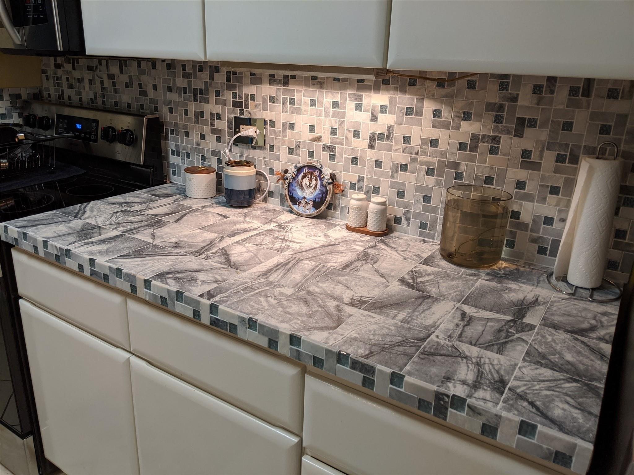 3760 Inverrary Drive, Unit 3L Lauderhill, FL 33319 - Photo 6 of 10 a bathroom with a sink a toilet and a shower