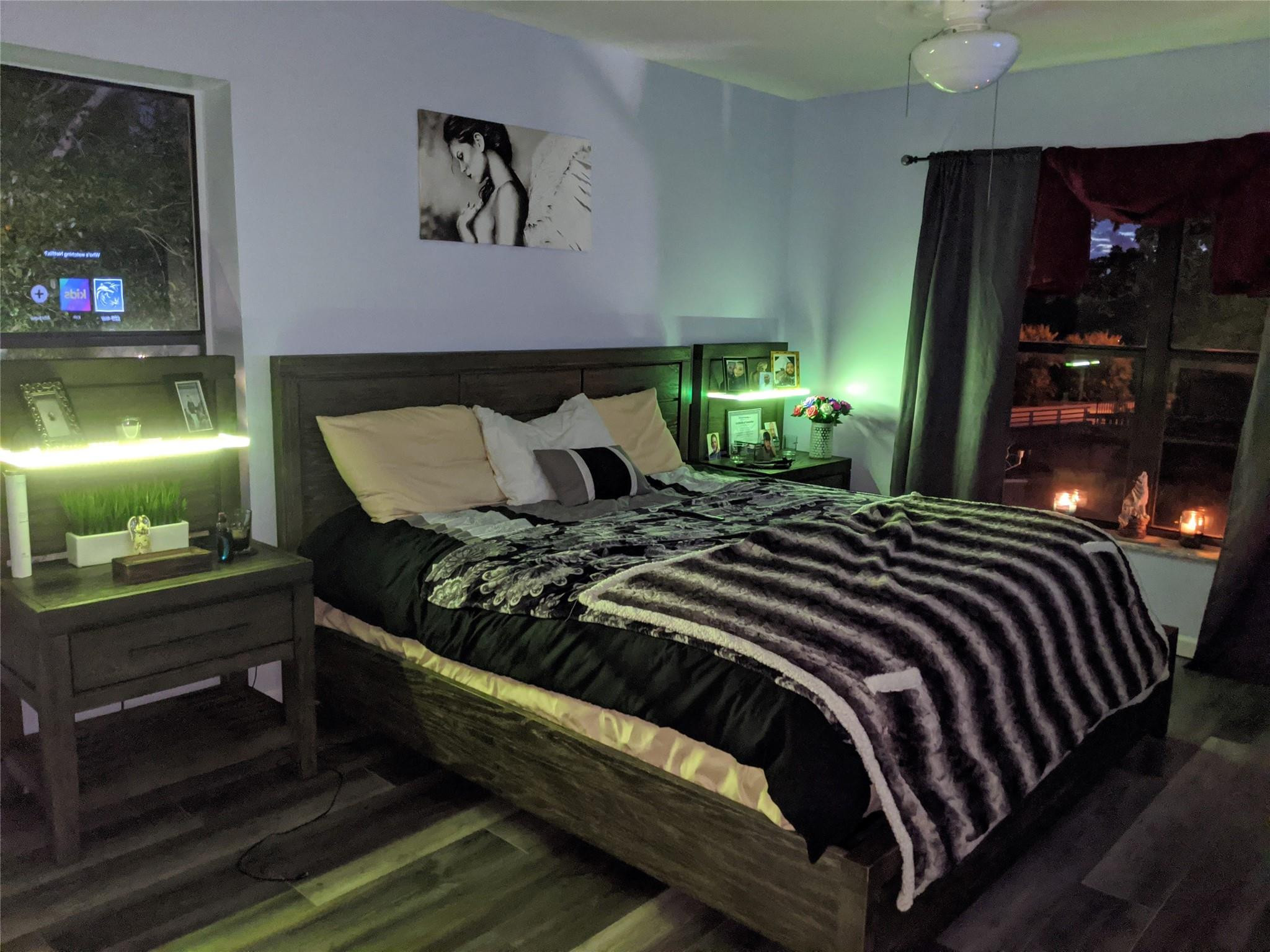 3760 Inverrary Drive, Unit 3L Lauderhill, FL 33319 - Photo 9 of 10 a bed sitting in a bedroom next to a lamp