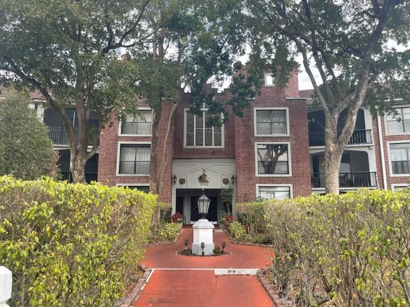 3760 Inverrary Drive, Unit 3L Lauderhill, FL 33319 - Photo 10 of 10 a front view of a house with fountain and tree