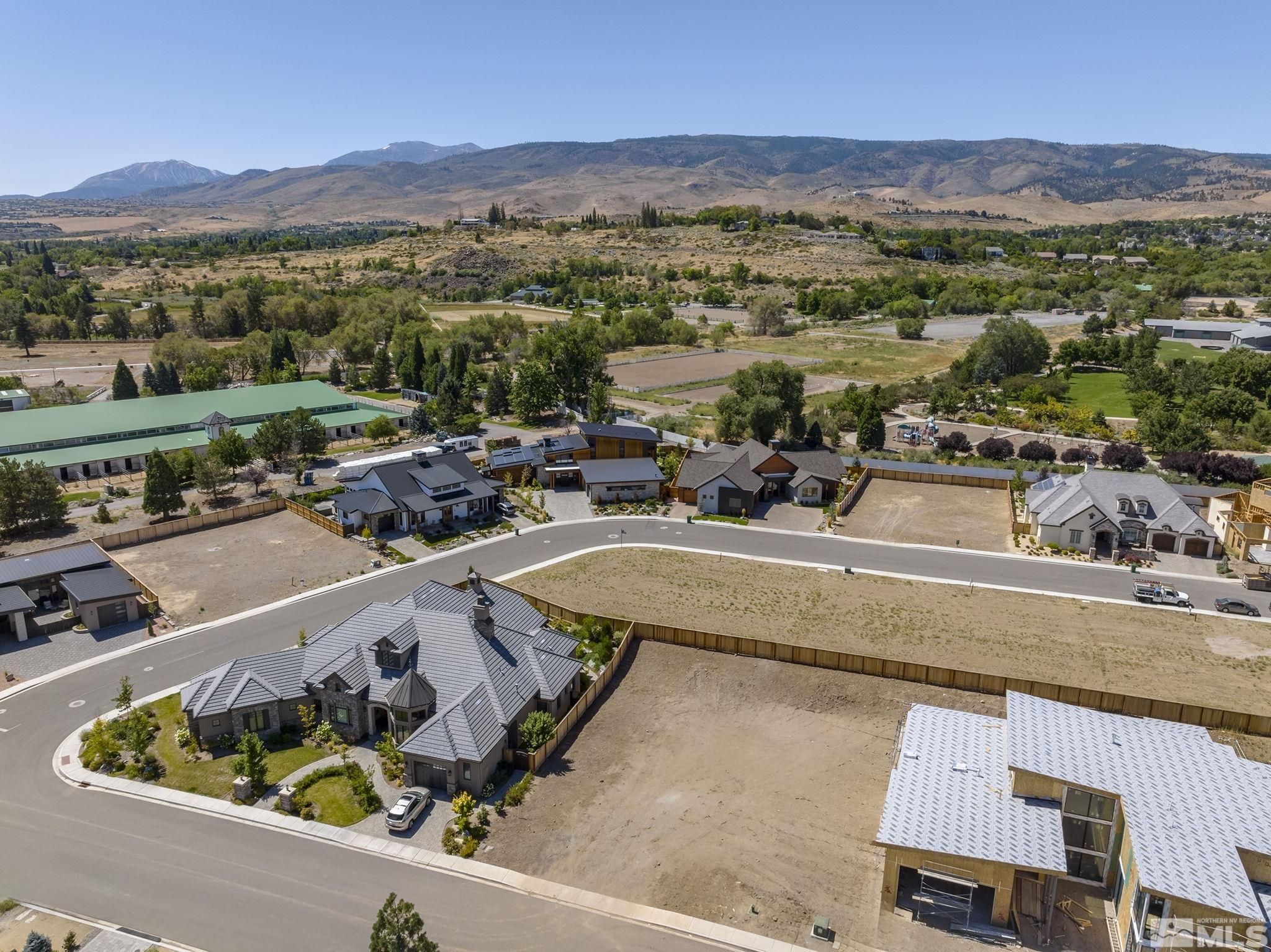 6151 Falabella Way Reno, NV 89511 - Photo 5 of 19 an aerial view of a house with a swimming pool patio and mountain view
