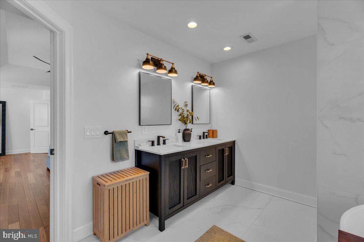 425 Peltoma Road Haddonfield, NJ 08033 - Photo 19 of 33 a bathroom with a sink double vanity and mirror
