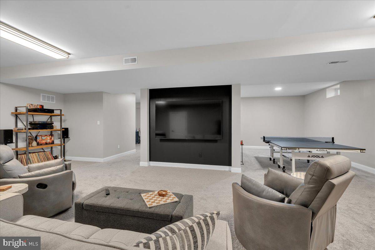 425 Peltoma Road Haddonfield, NJ 08033 - Photo 24 of 33 a living room with furniture and a flat screen tv