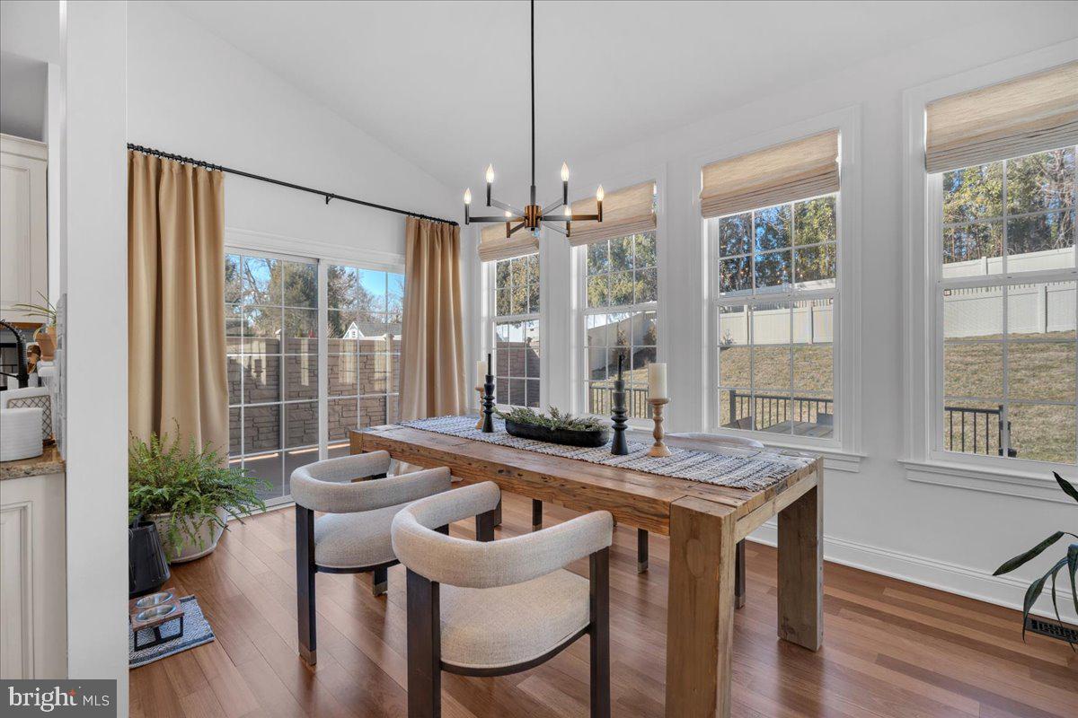 425 Peltoma Road Haddonfield, NJ 08033 - Photo 8 of 33 a view of a dining room with furniture window and wooden floor