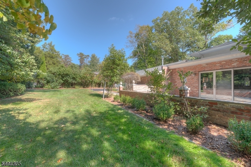 218 Devon Road Essex Fells, NJ 07021 - Photo 12 of 14 a view of a house with a backyard