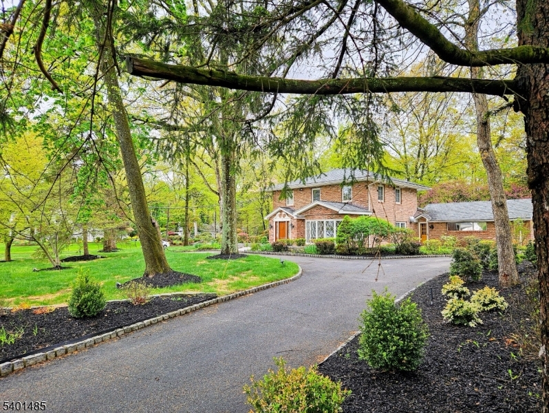 218 Devon Road Essex Fells, NJ 07021 - Photo 16 of 23 a view of a garden with a large trees