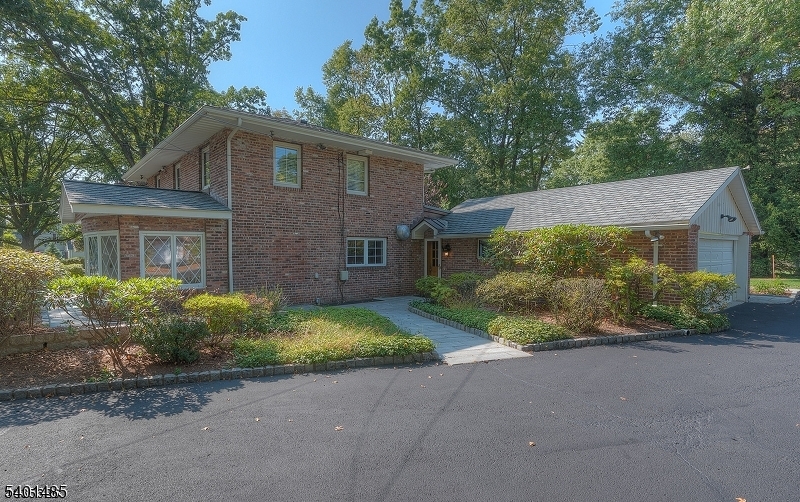218 Devon Road Essex Fells, NJ 07021 - Photo 2 of 14 front view of a house with a yard